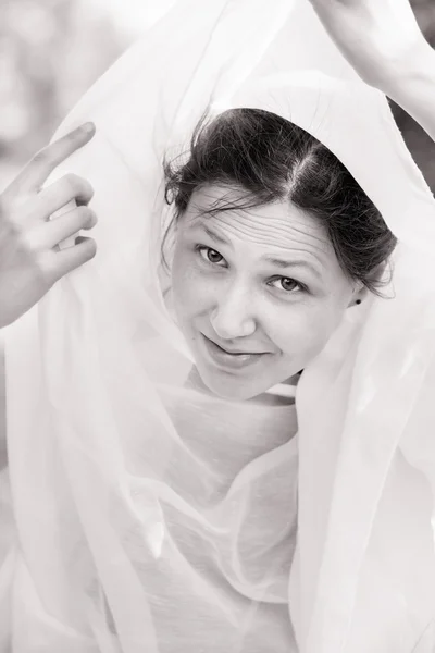 Portrait of a girl vested with a white cloth — Stock Photo, Image