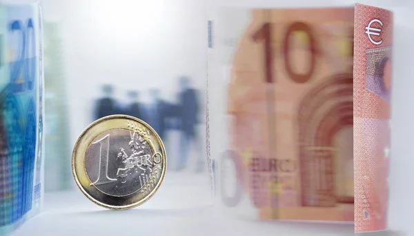 Euro currency and people silhouettes — Stock Photo, Image