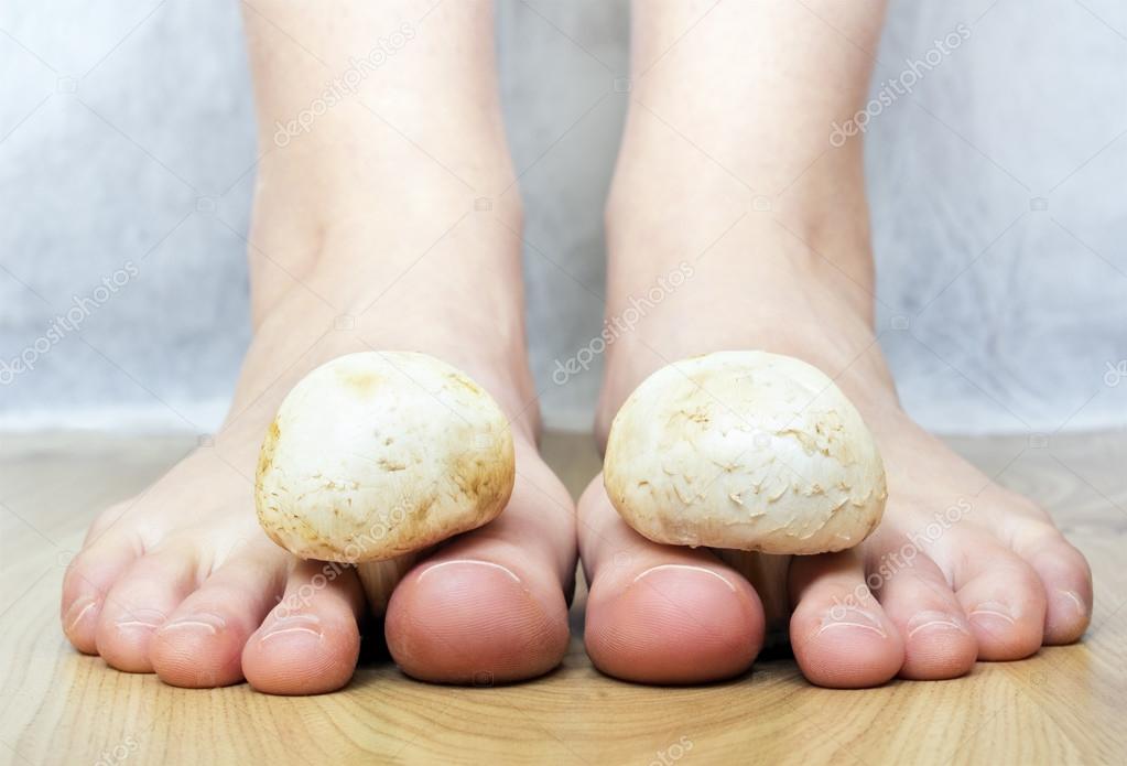Mushrooms between the toes feet imitating toes fungus