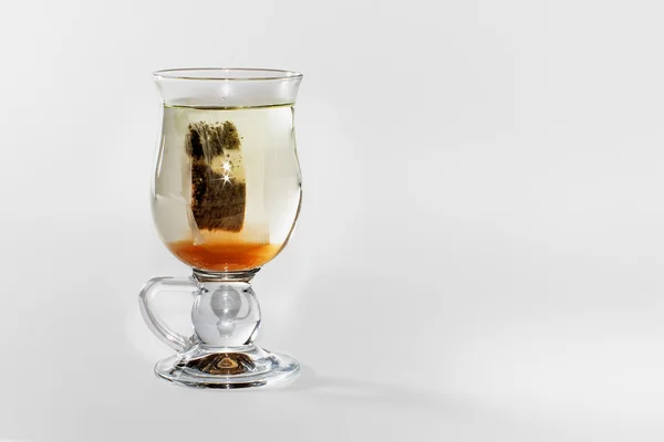 Glas te med en tepåse — Stockfoto