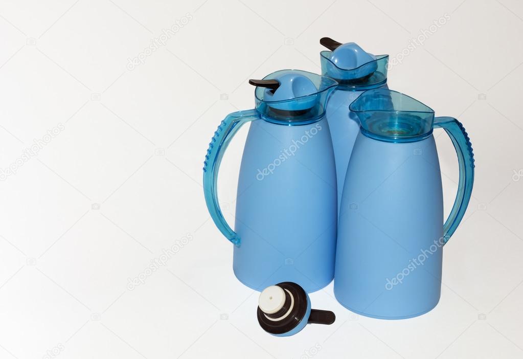 Three blue thermoses