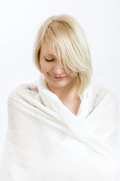 Smiling young woman with white cloth — Stock Photo, Image