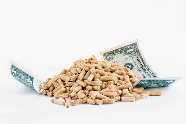 Billetes de un dólar y pellets de madera — Foto de Stock