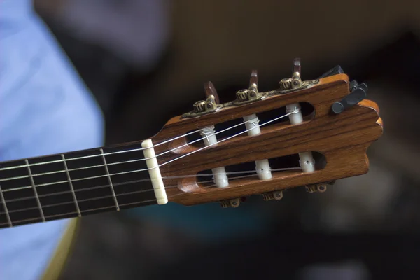 Acoustic guitar's fretboard head — Stockfoto