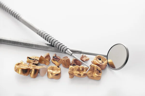 Removed from teeth old golden dental bridge — Stock Photo, Image