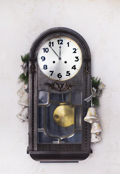 Antique New Year's clock on a  wall with a Christmas  toys — Stock Photo, Image