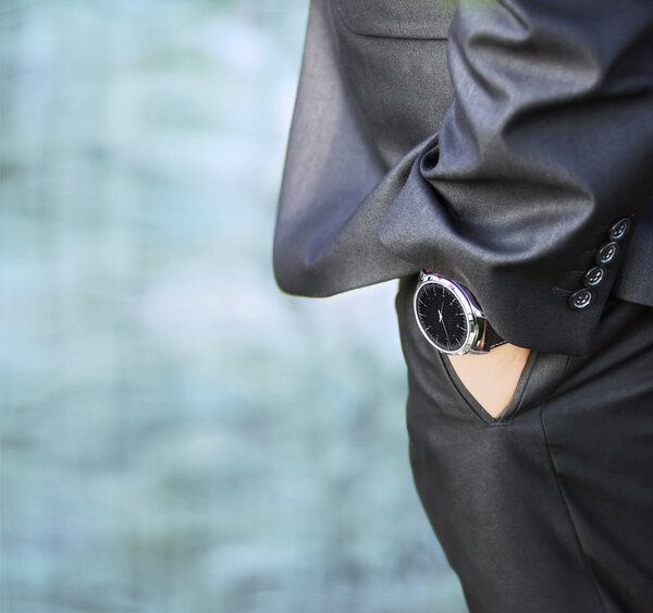 Man's hand wearing a watch
