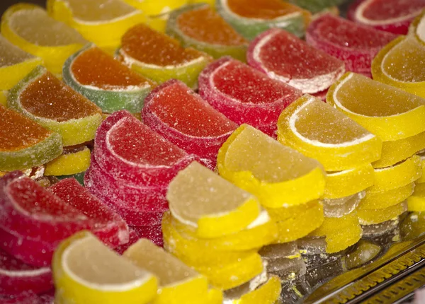 Colorful  juicy jelly candies on market stall as a background — Stock Photo, Image