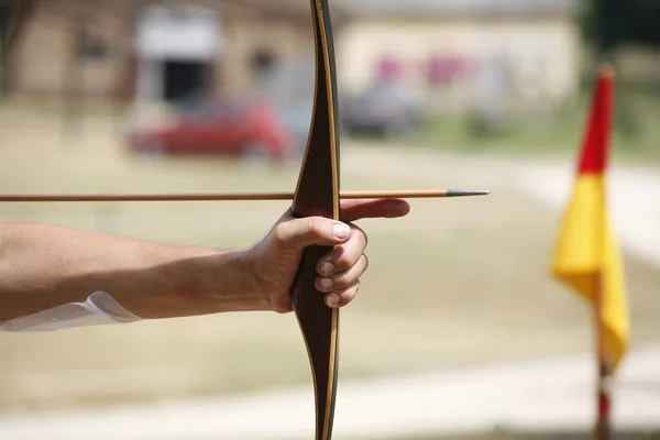 Unidentified pretty young girl hold bow and arrow — Stock Photo, Image