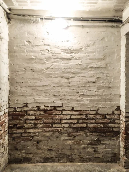 Old brick wall deteriorated by moisture, Parma Italy. High quality photo