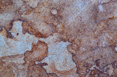 Kum taşı dokusuyla ilgili detaylar, kapağında vignette olan kaya yüzeyinin yakın çekimi ve merkezinde parlak bir nokta, arkaplan ya da arkaplan fikri.