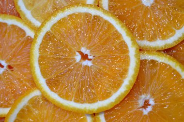 Portakal dilimli narenciye ile soyut bir arka plan. Kapatın. Stüdyo fotoğrafçılık.