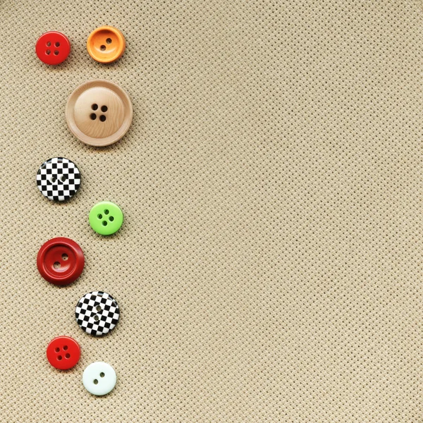 Кнопки на ткани — стоковое фото
