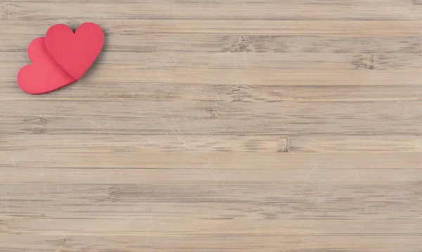 Красные деревянные сердца на деревянном фоне Стоковое Изображение