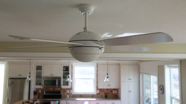 Cieling fan spinning in a house — Stock Video