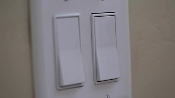 Hand turning on a light switch — Stock Video