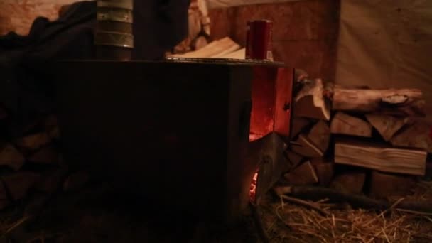 Hunters warming their dinner — стоковое видео