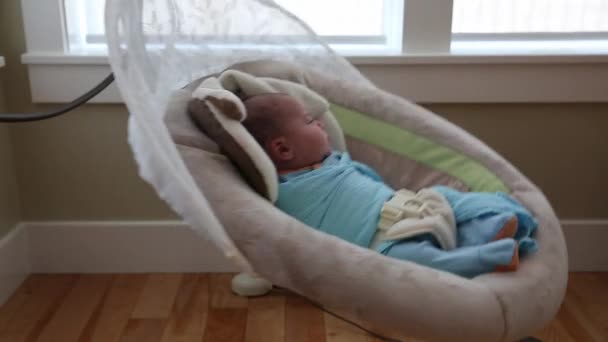 Newborn baby in a swing — Stock Video