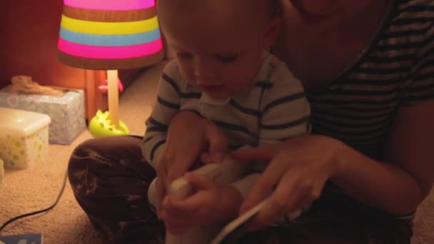 Baby and mother reading book — Stock Video