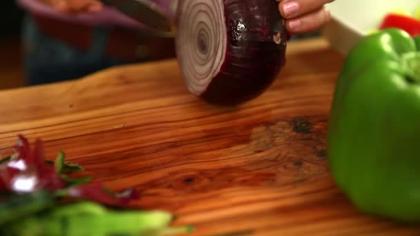 Woman cuts onion — Stock Video