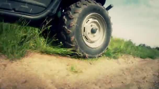 Wheeler traveling on a dirt road — Stock Video