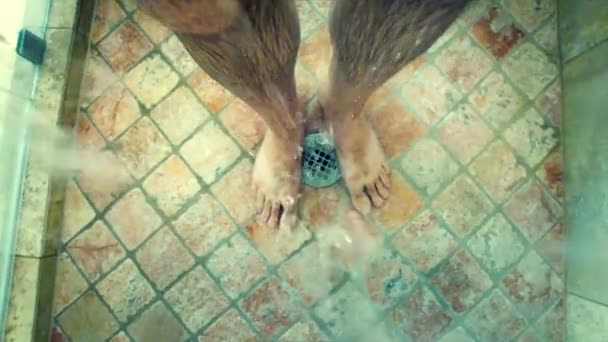 Man bathing in a shower — Stock Video