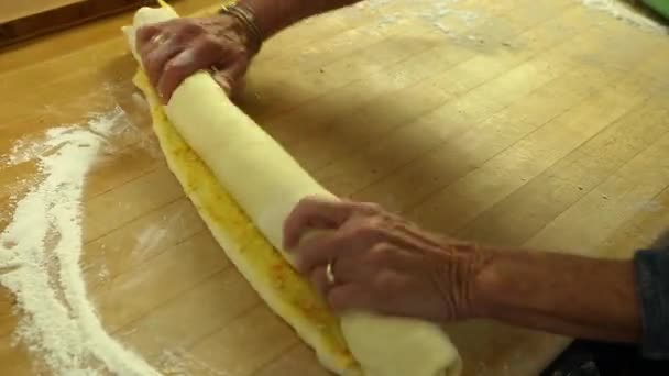 Woman making orange rolls — Stock Video