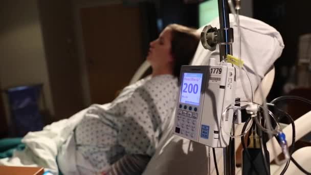 Woman on bed with an iv — Stock Video