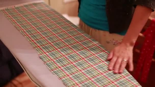 A woman irons cotton fabric — Stock Video