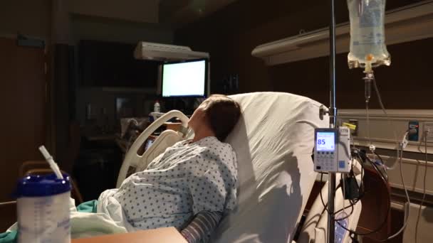 Woman on bed with an iv — Stock Video