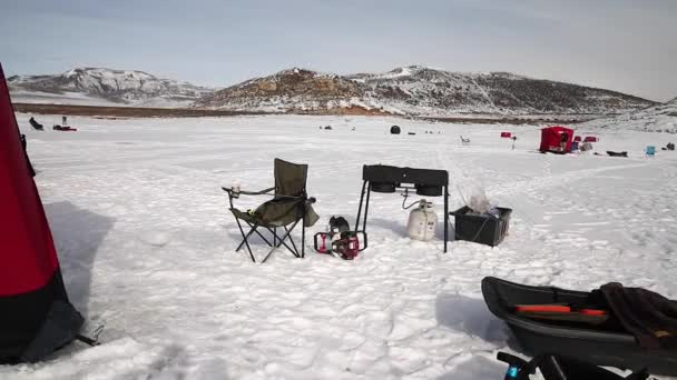 Ice fishing camp tent on a lake — Stock Video