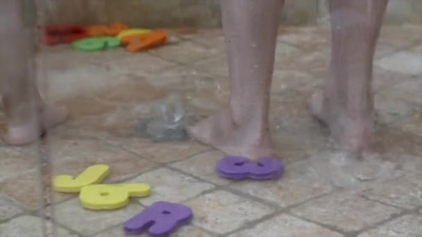 Boy plays in shower with his mom — Stock Video
