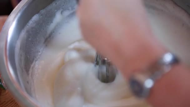 Woman whisks egg whites — Stock Video