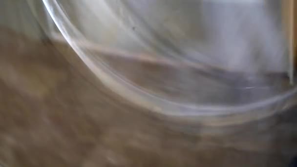 Clothes tumble inside a washing machine — Stock Video