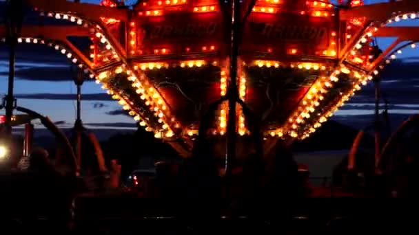 Carnival rides in an amusement park — Stock Video