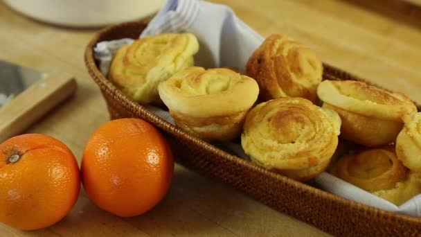 Freshly baked orange rolls — Stock Video