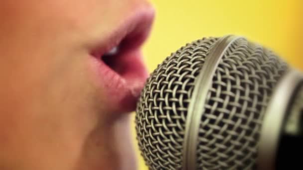 Girl singing into microphone — Stock Video