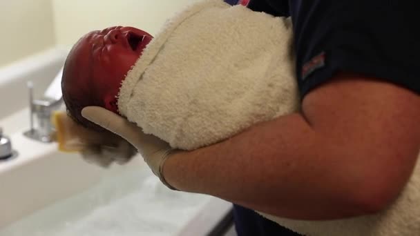 Newborn baby being cleaned — Stock Video