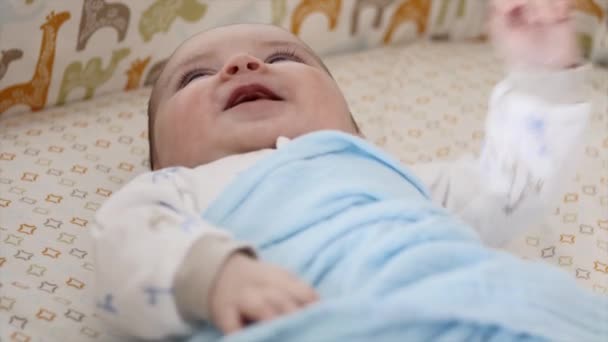 Newborn baby boy in crib — Stock Video