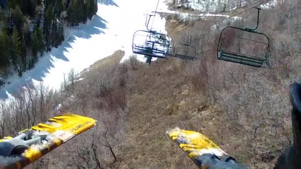 Man rides up a chair lift — Stock Video