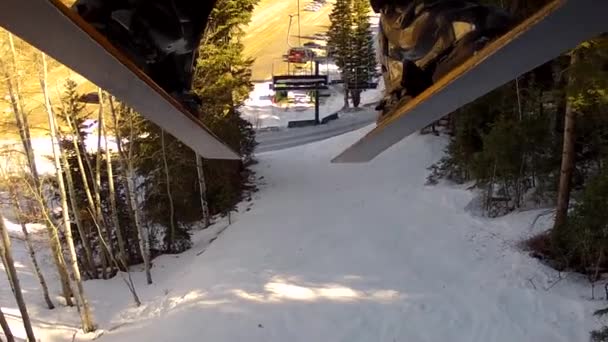 Man rides up a chair lift — Stock Video