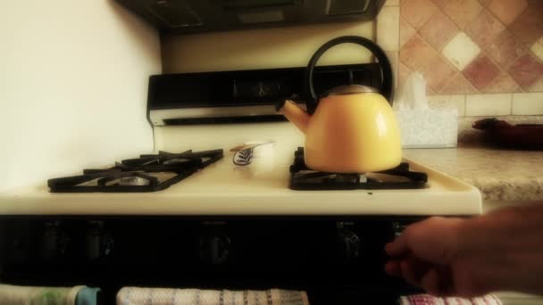 Tea kettle heating on the stove — Stock Video