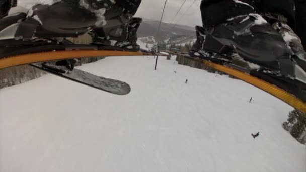 Man rides up a chair lift — Stock Video