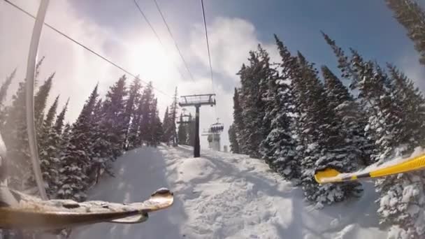 Man rides up a chair lift — Stock Video