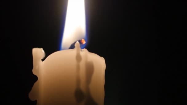 Lit candle in a dark room Royalty Free Stock Video