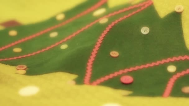 Woman sewing buttons on calendar — Stock Video