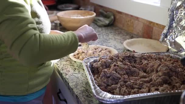 Woman filling meat for meat pies — Stock Video