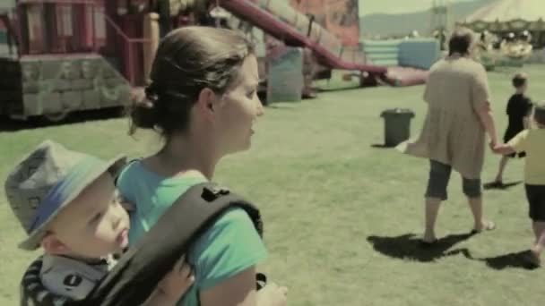 Young family at a carnival — Stock Video