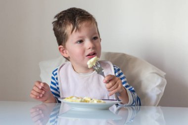Baby eats top view kitchen Breakfast copyspace