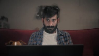 A mixed race man working from home